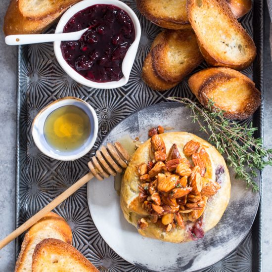 Baked Brie en Croute with Honeyed Almonds, Cherries and Thyme