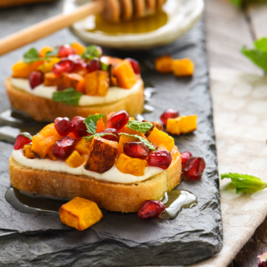 Butternut Squash and Pomegranate Crostini with Whipped Feta and Honey